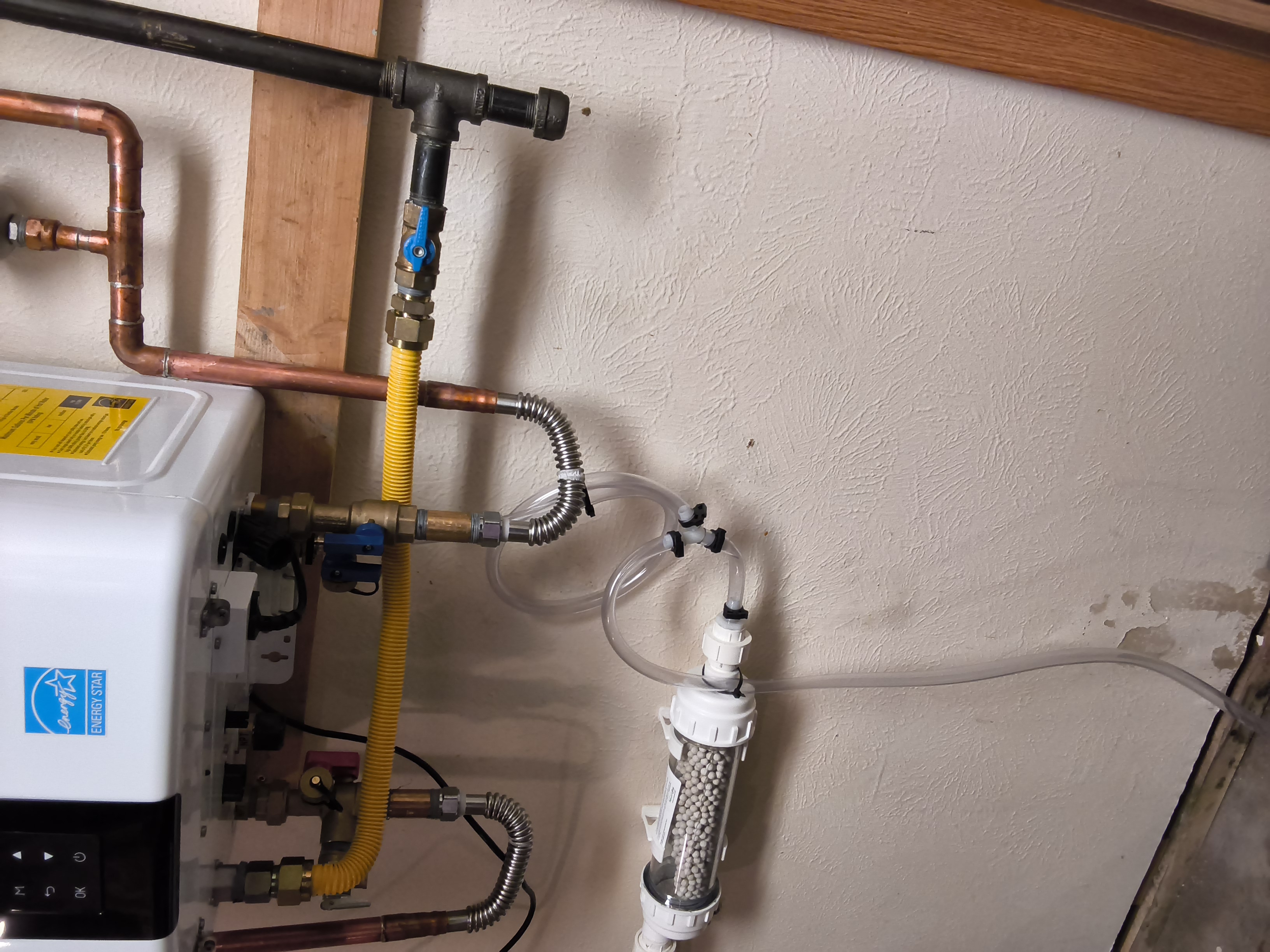 Navien tankless water heater installed on wall