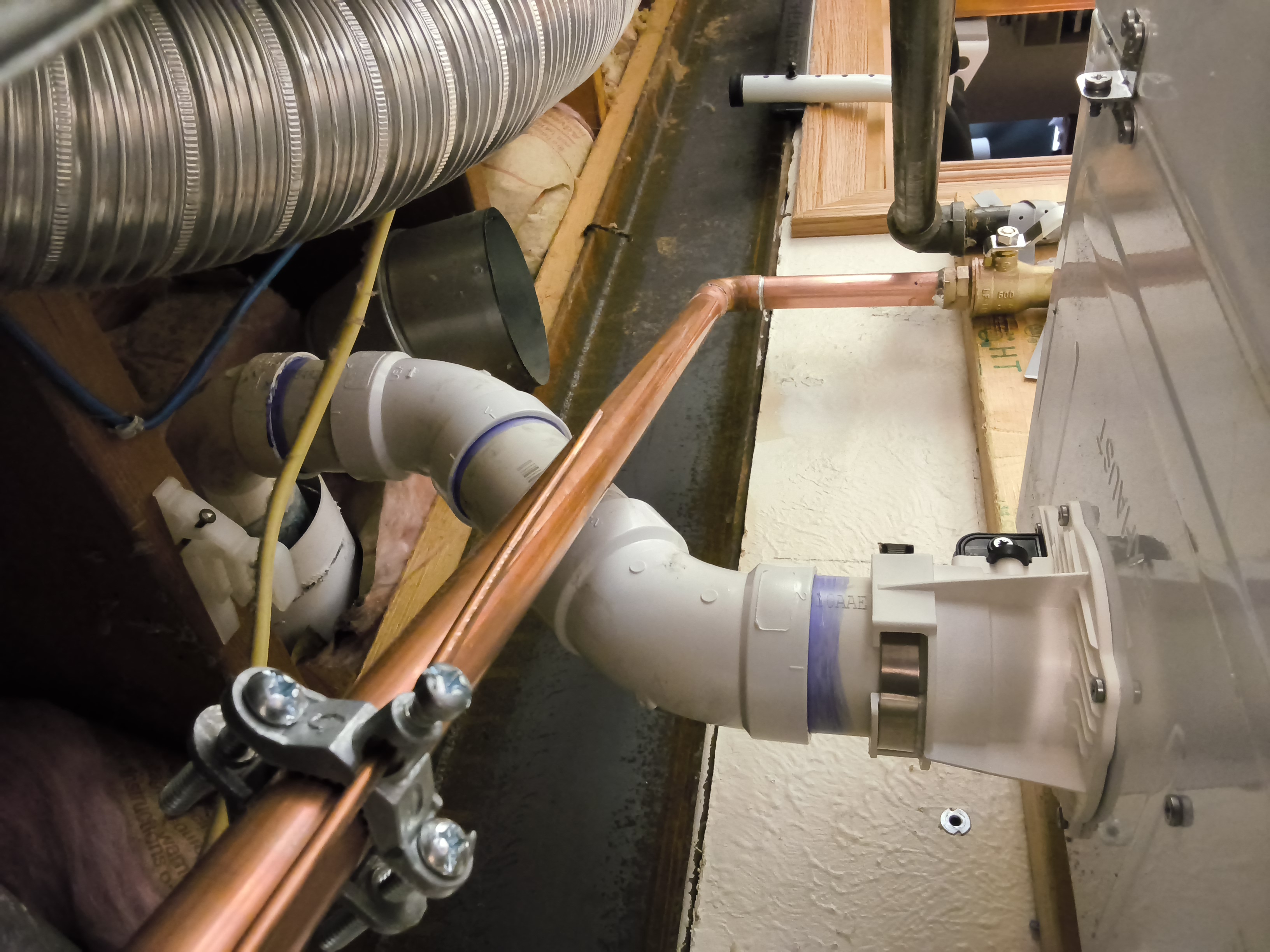 Close view of copper piping and scale prevention equipment